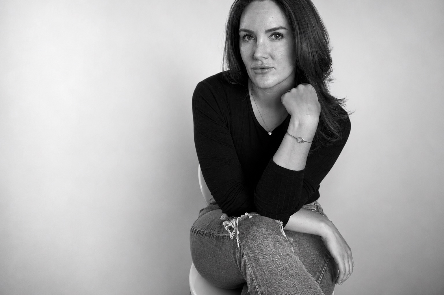 Kellsie Moore seated in a black top